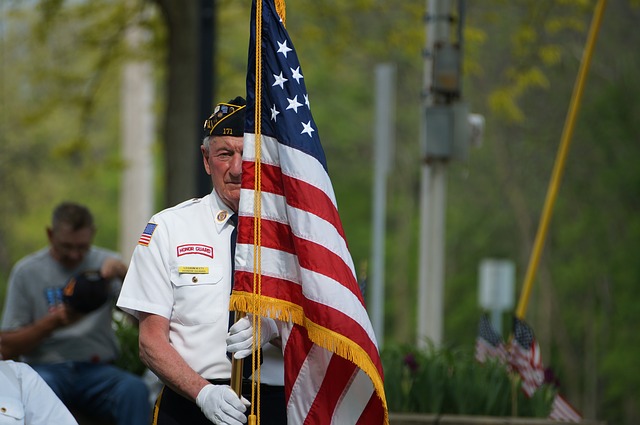 honor guard of man holding American flag